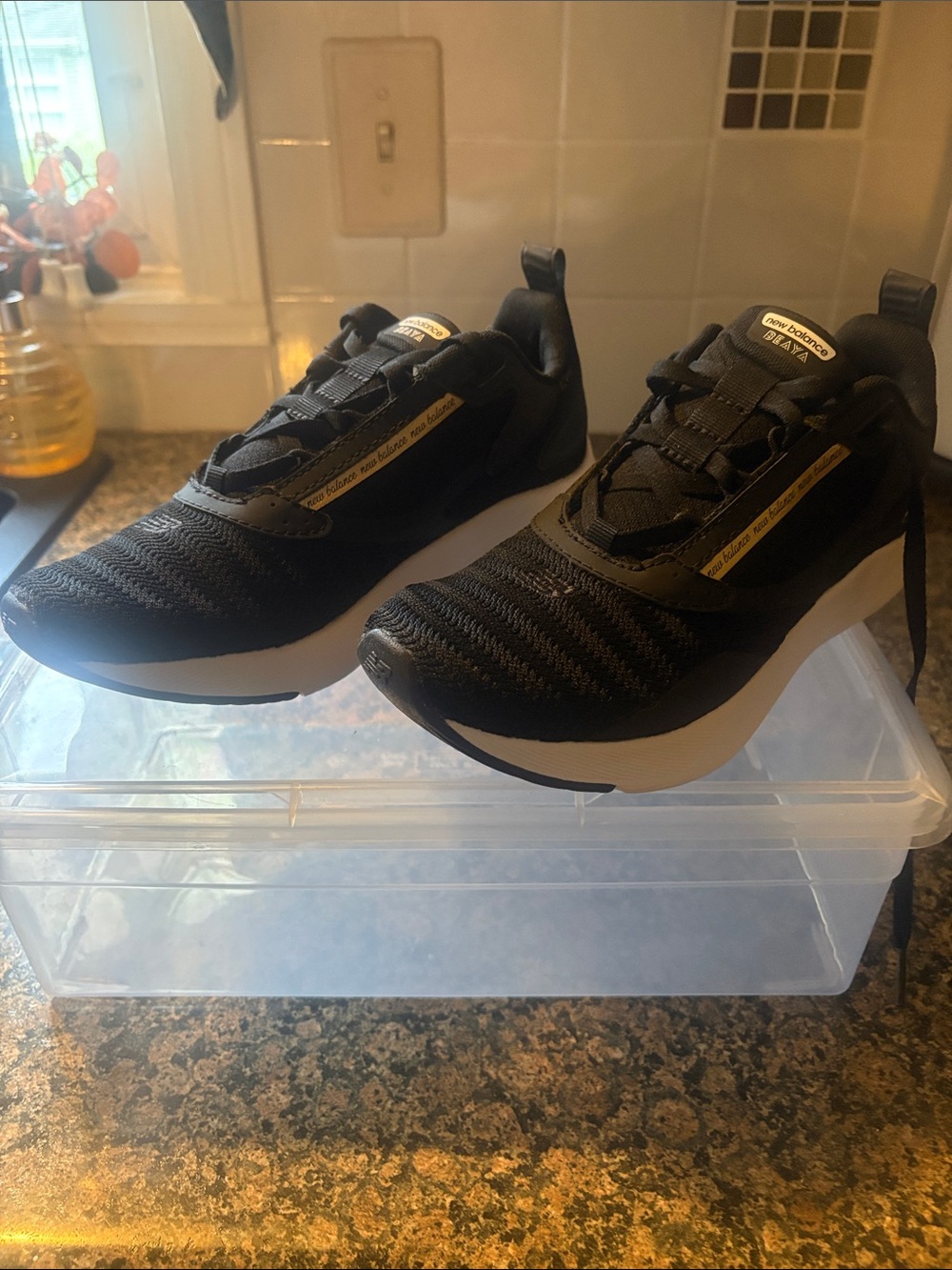 New Balance Black and White Women's Running Sneakers with Gold Accents